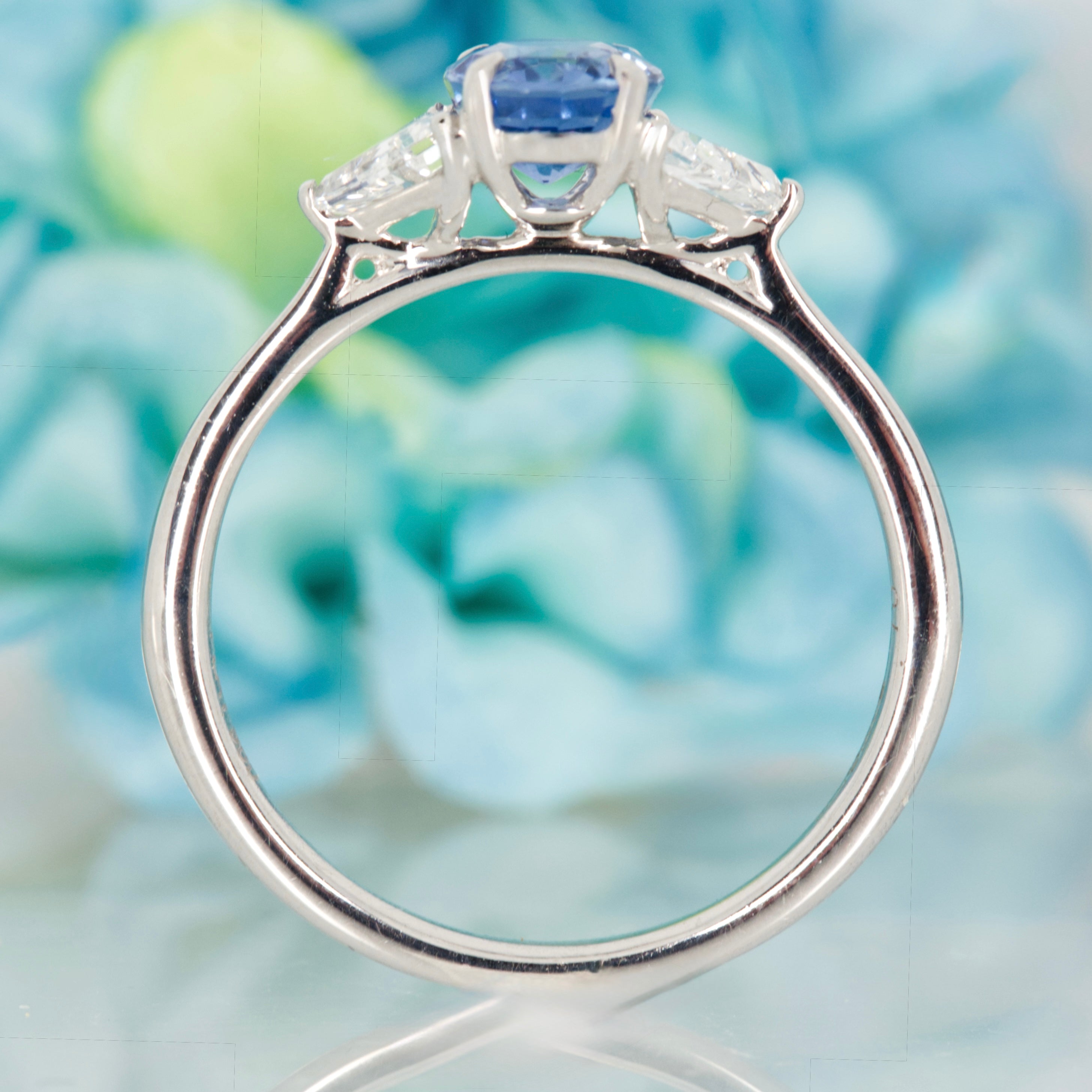 Platinum Oval Cut Sapphire & Trilliant Cut Diamond Trilogy Ring