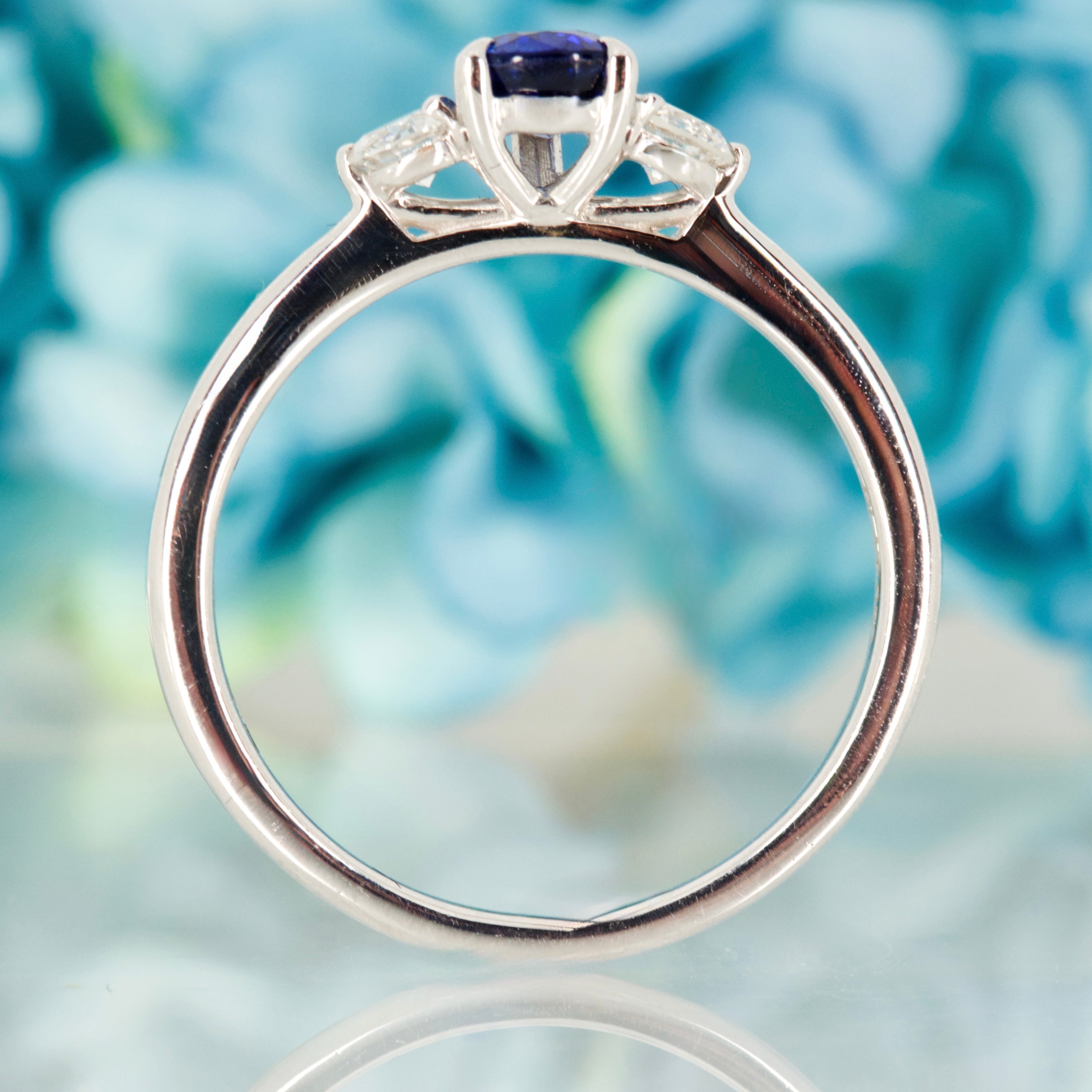 Platinum Pear Cut Sapphire & Round Brilliant Cut Diamond Trilogy Ring