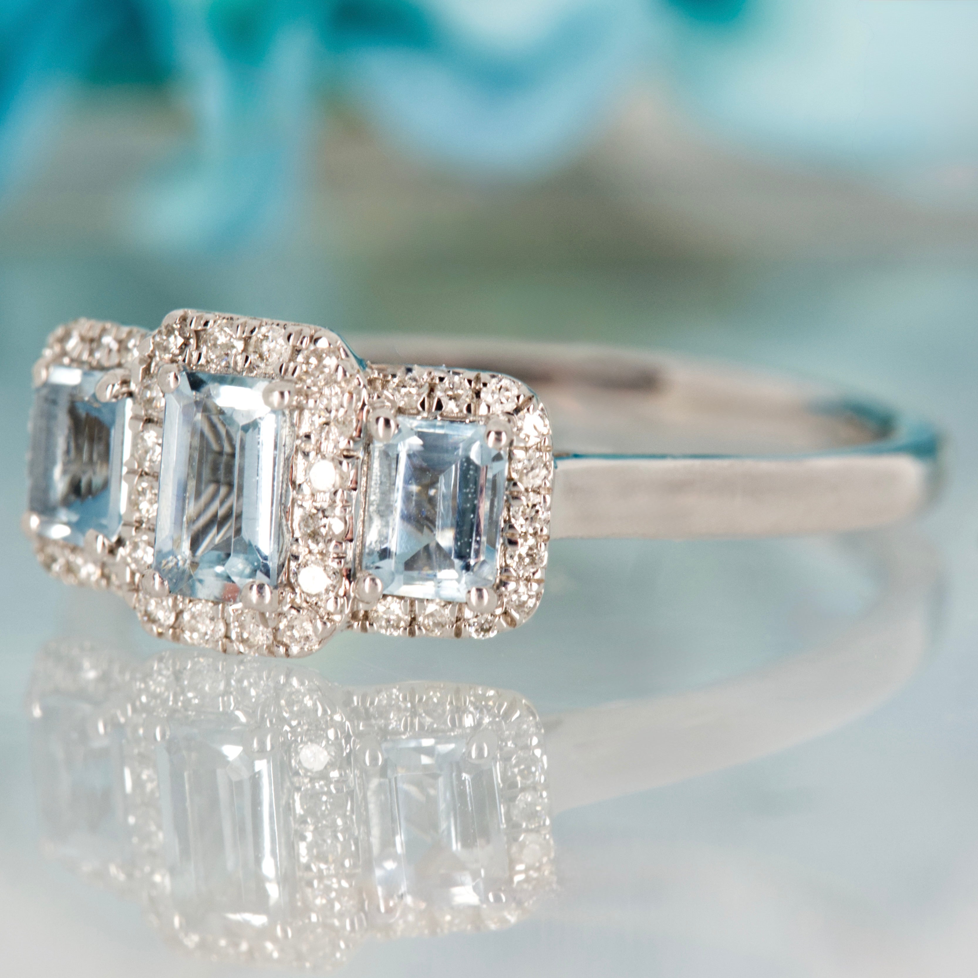 9ct White Gold Octagonal Cut Aquamarine & Round Brilliant Cut Diamond Triple Cluster Ring