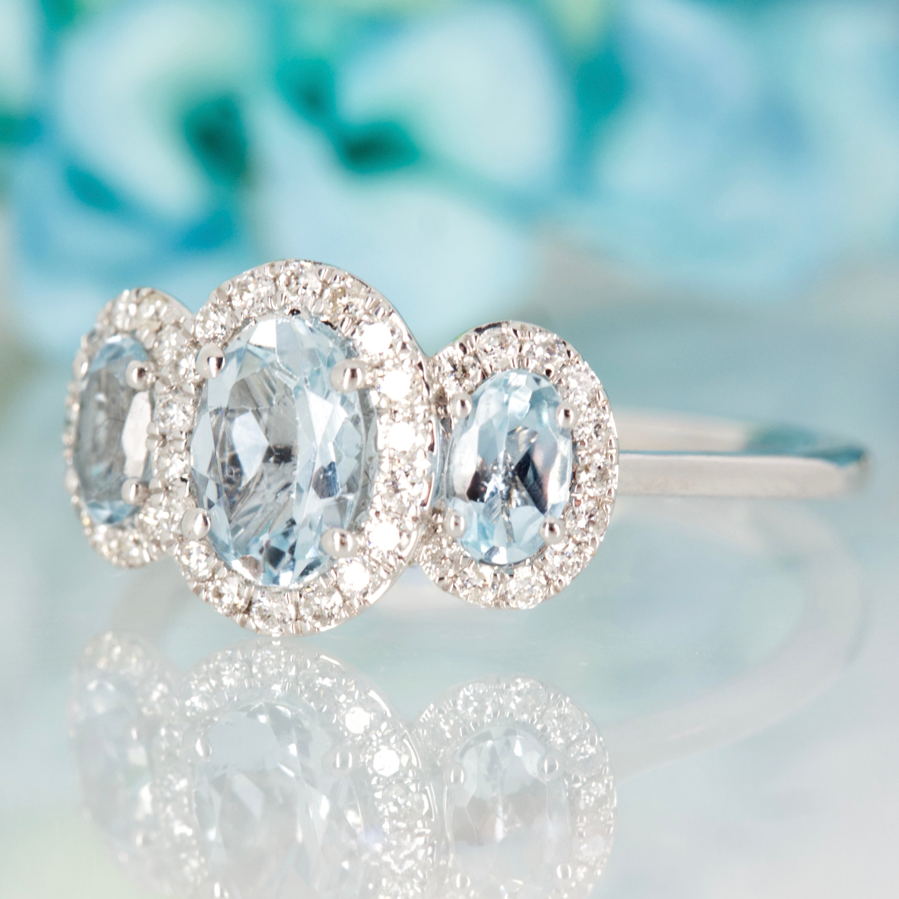 9ct White Gold Oval Cut Aquamarine & Round Brilliant Cut Diamond Triple Halo Cluster Ring