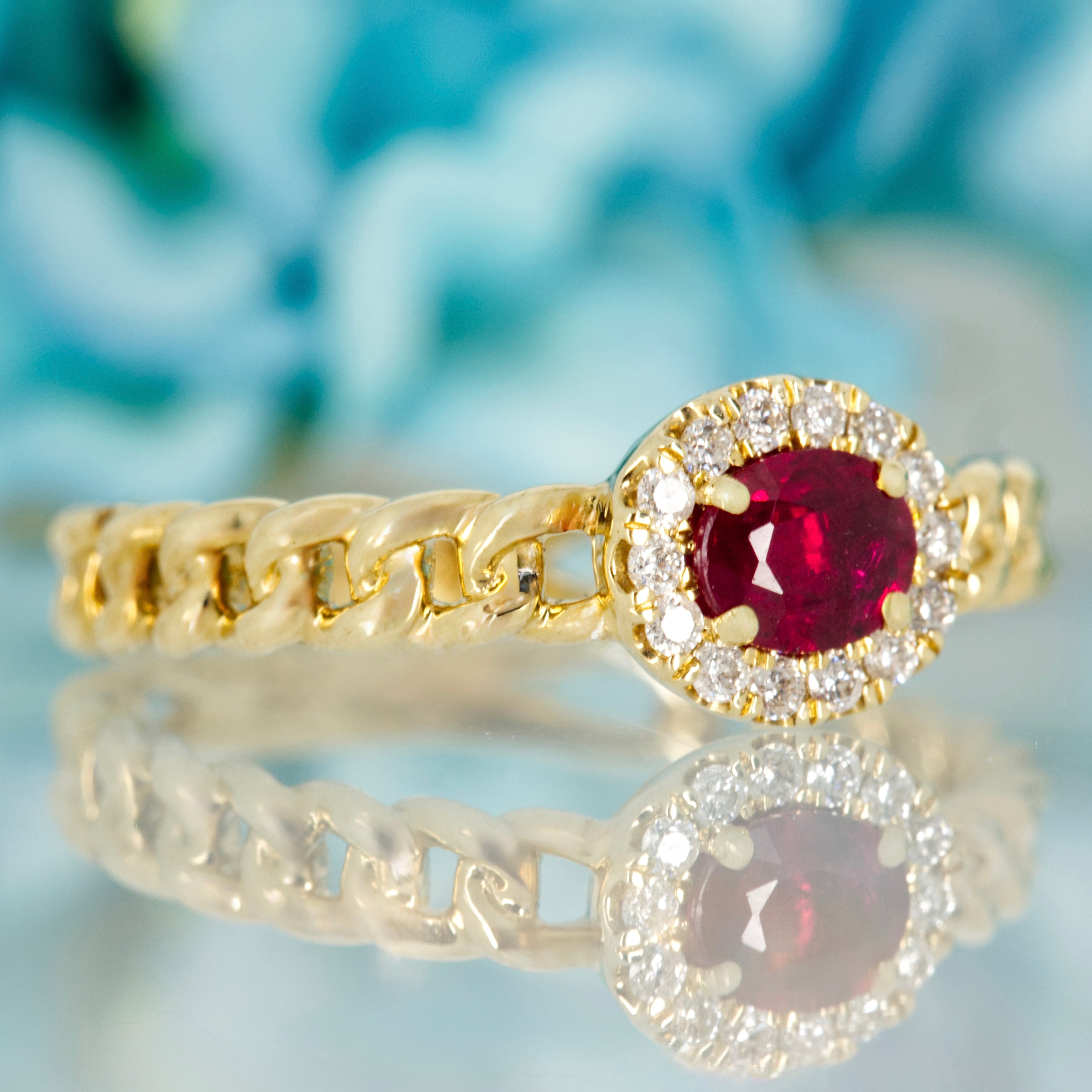 9ct Yellow Gold Oval Cut Ruby & Round Brilliant Cut Diamond Horizontal Halo Cluster Ring