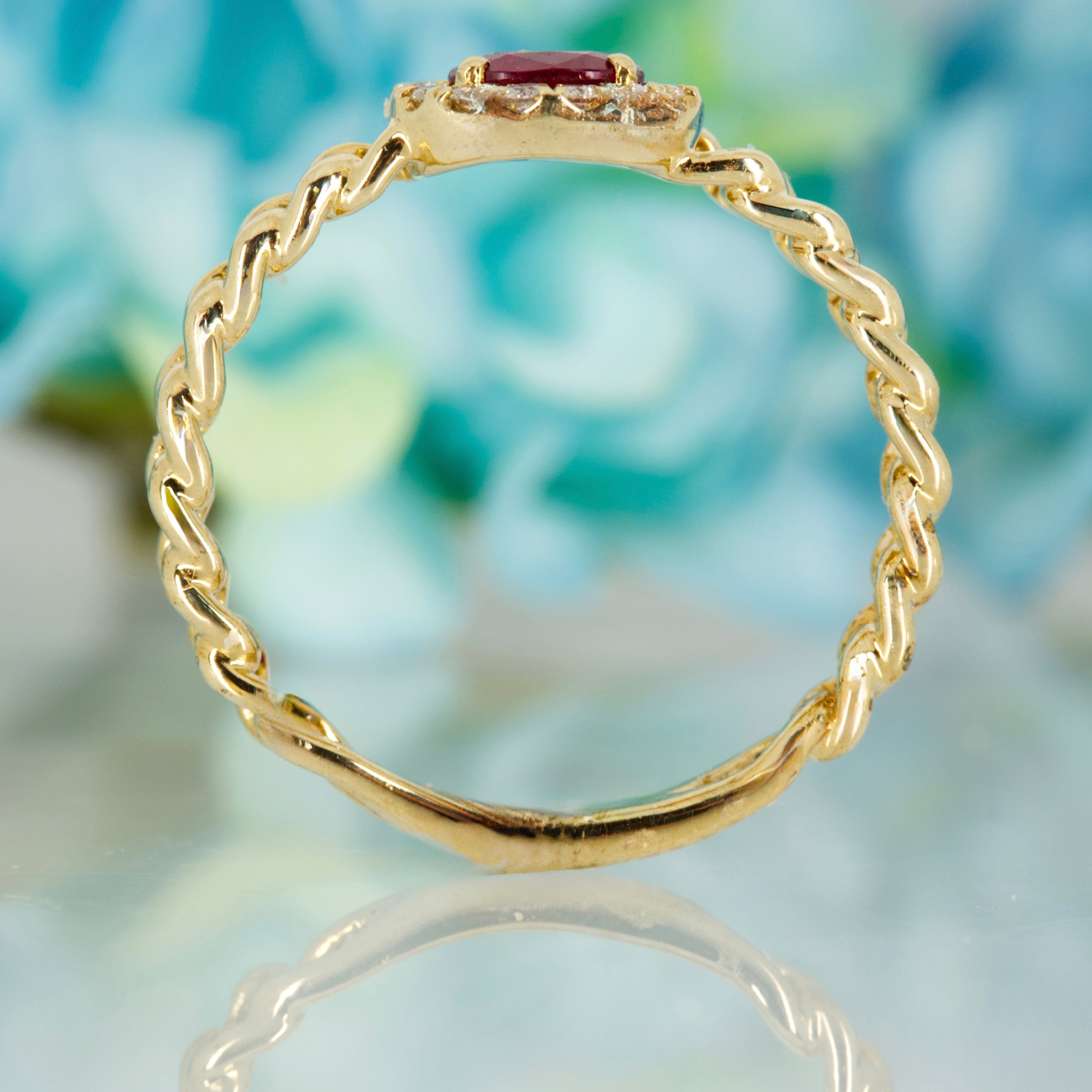 9ct Yellow Gold Oval Cut Ruby & Round Brilliant Cut Diamond Horizontal Halo Cluster Ring