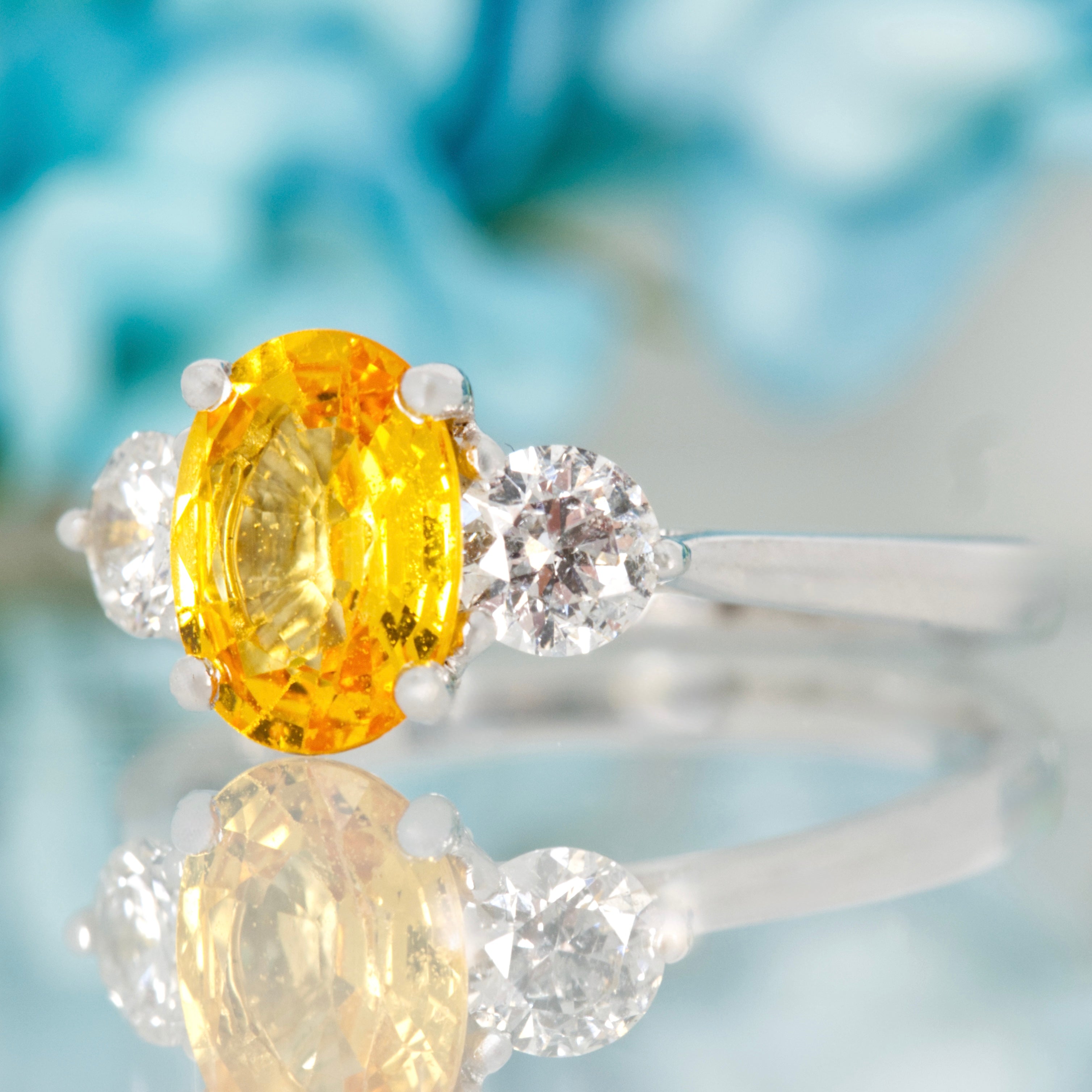 Platinum Oval Cut Yellow Sapphire & Round Brilliant Cut Diamond Trilogy Ring