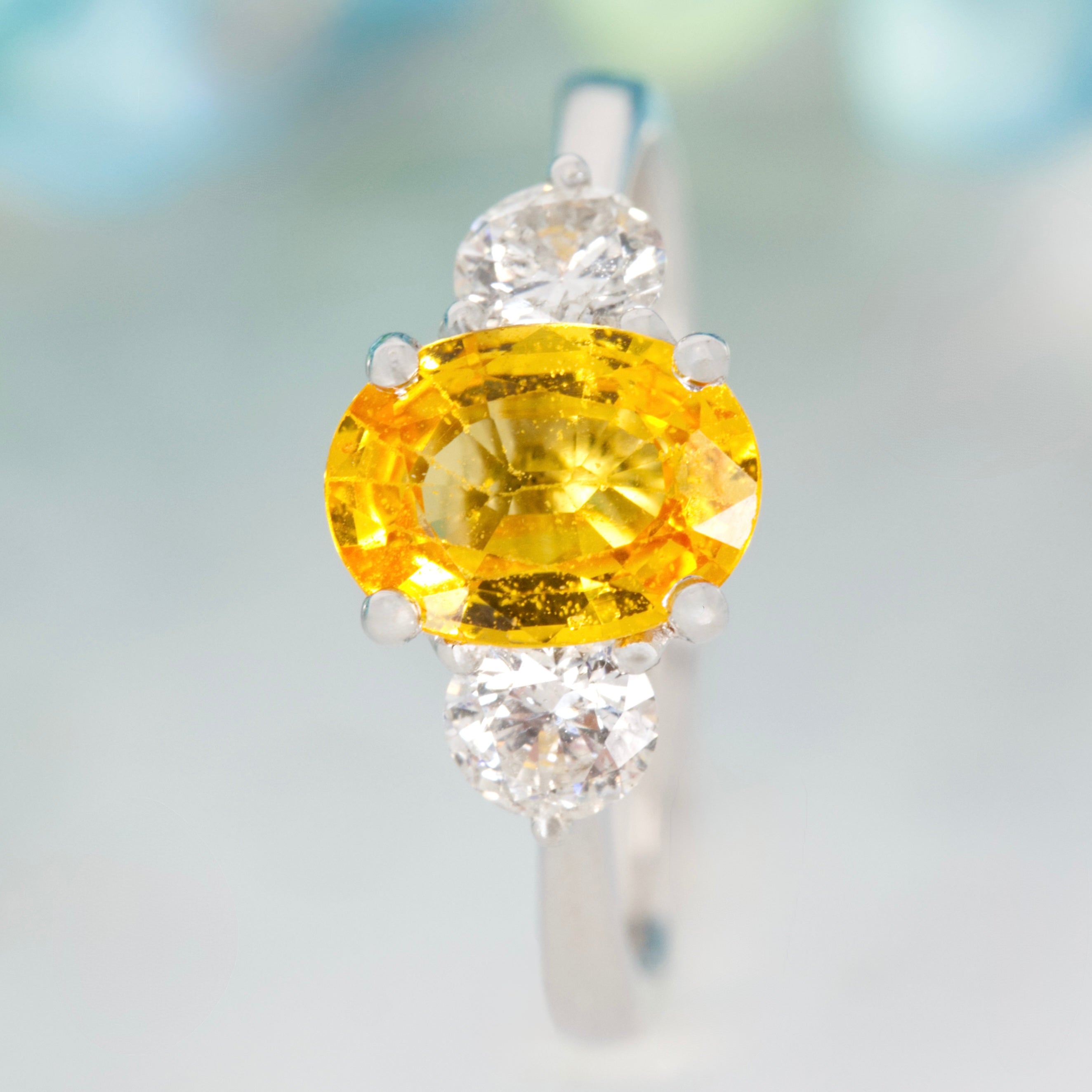 Platinum Oval Cut Yellow Sapphire & Round Brilliant Cut Diamond Trilogy Ring