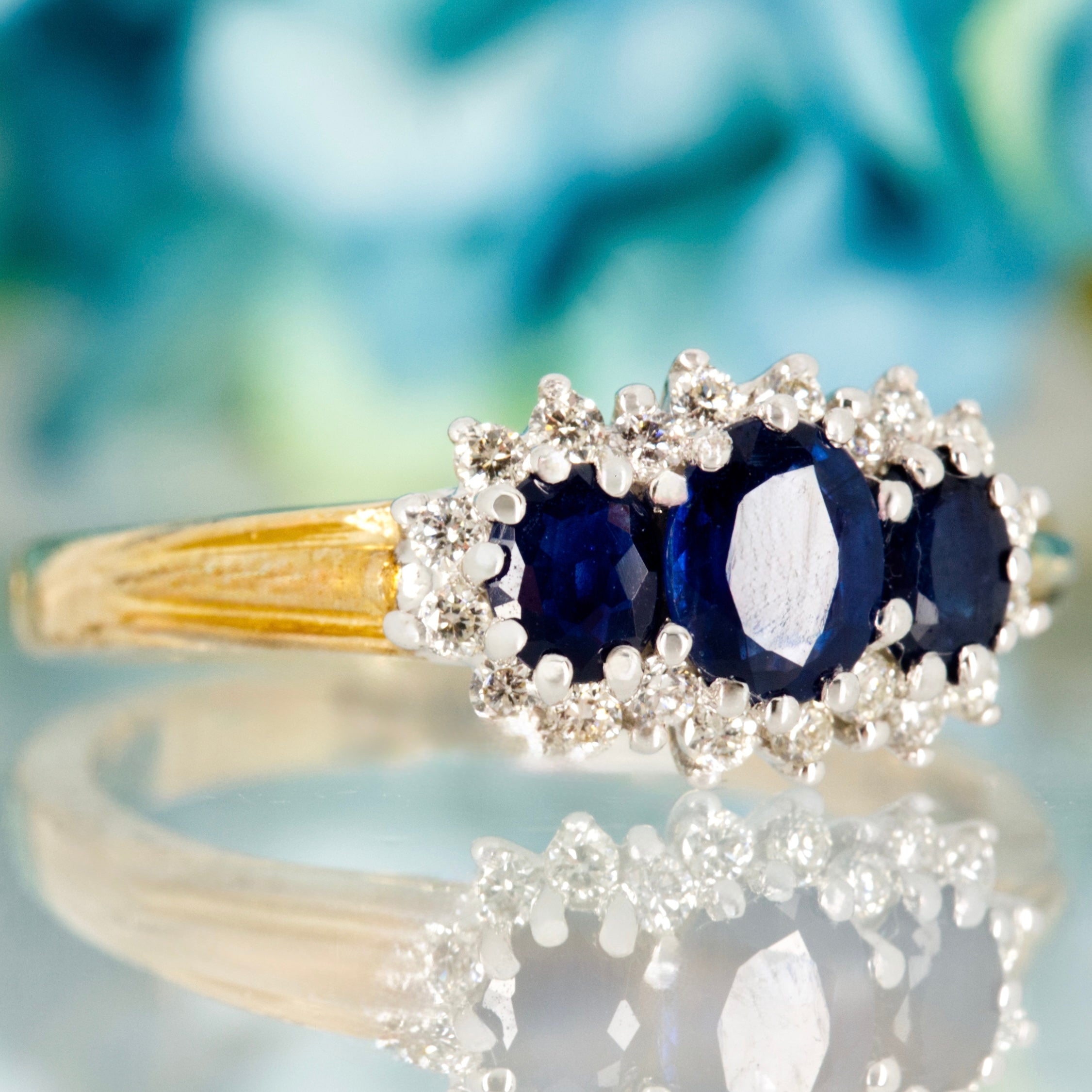 9ct Yellow Gold Oval Cut Sapphire & Round Brilliant Cut Diamond Triple Cluster Ring