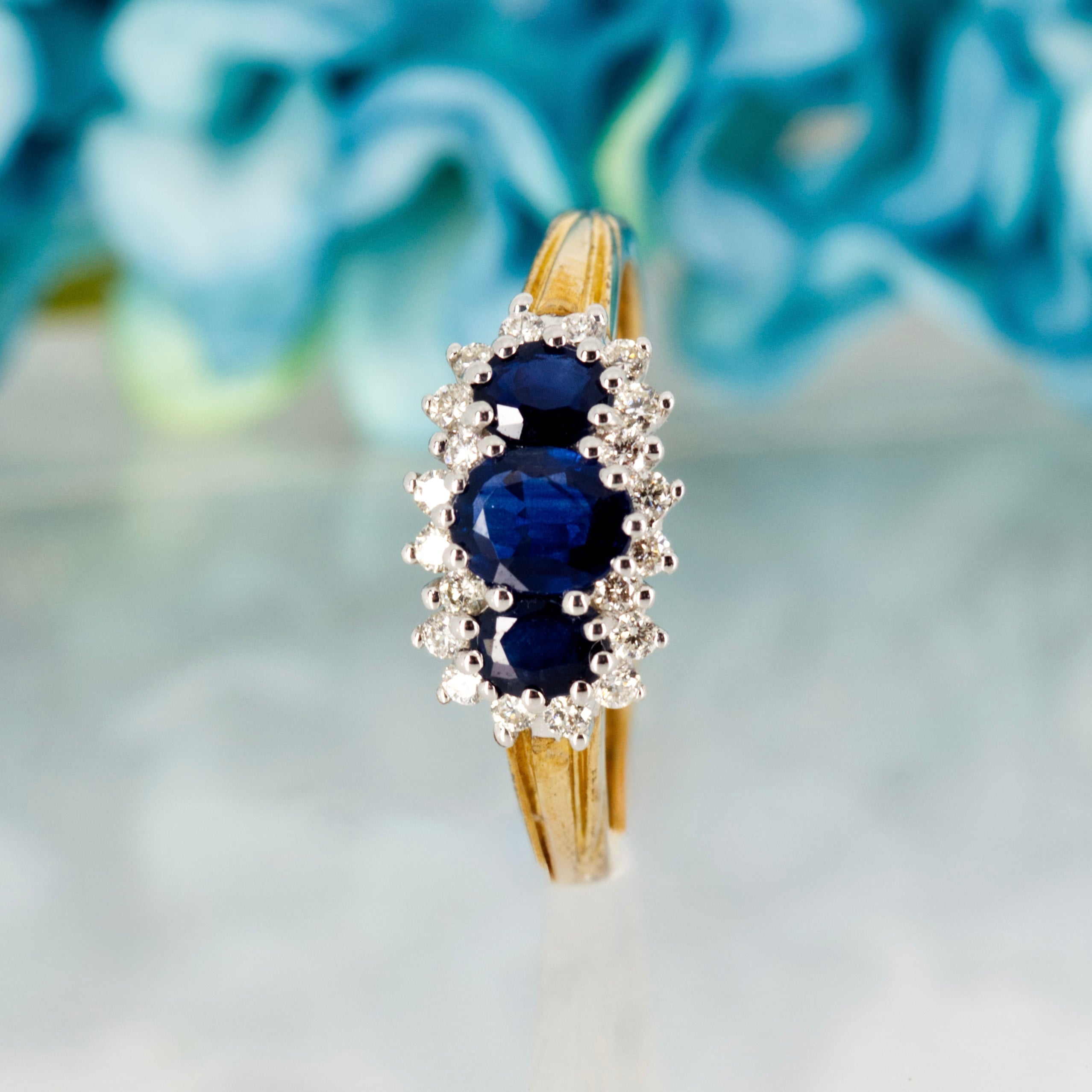 9ct Yellow Gold Oval Cut Sapphire & Round Brilliant Cut Diamond Triple Cluster Ring