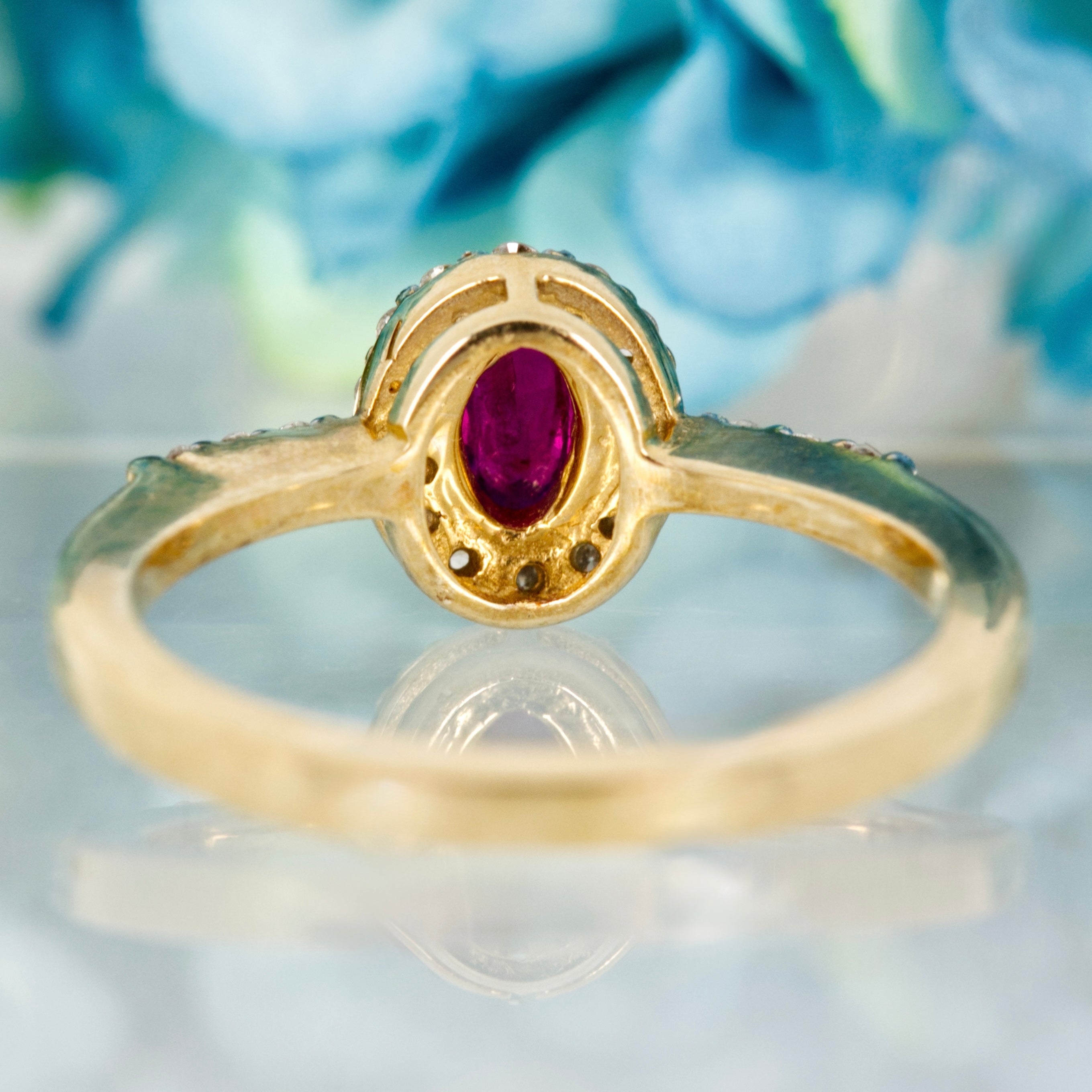 9ct Yellow Gold Oval Cut Ruby & Round Brilliant Cut Diamond Halo Cluster Ring