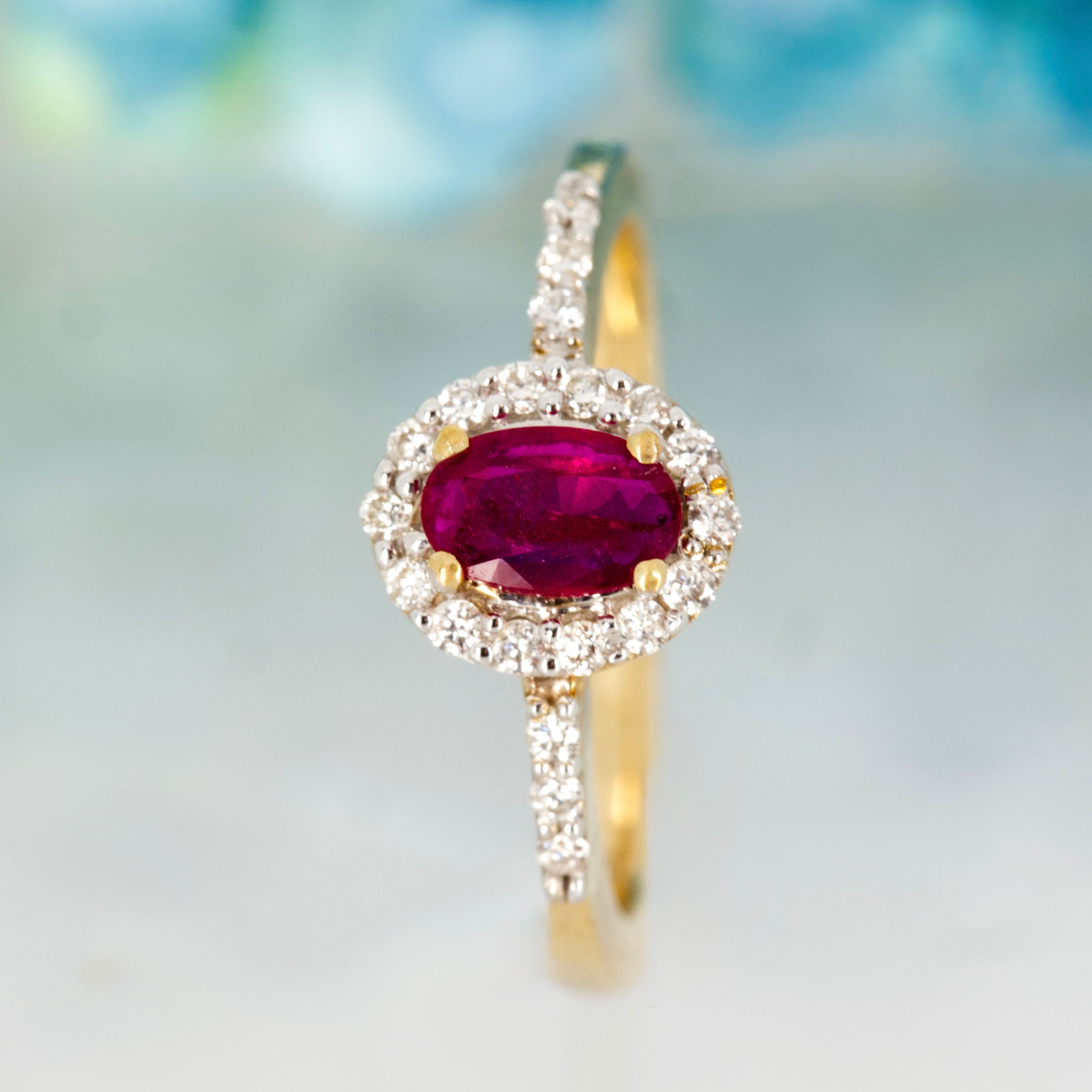 9ct Yellow Gold Oval Cut Ruby & Round Brilliant Cut Diamond Halo Cluster Ring