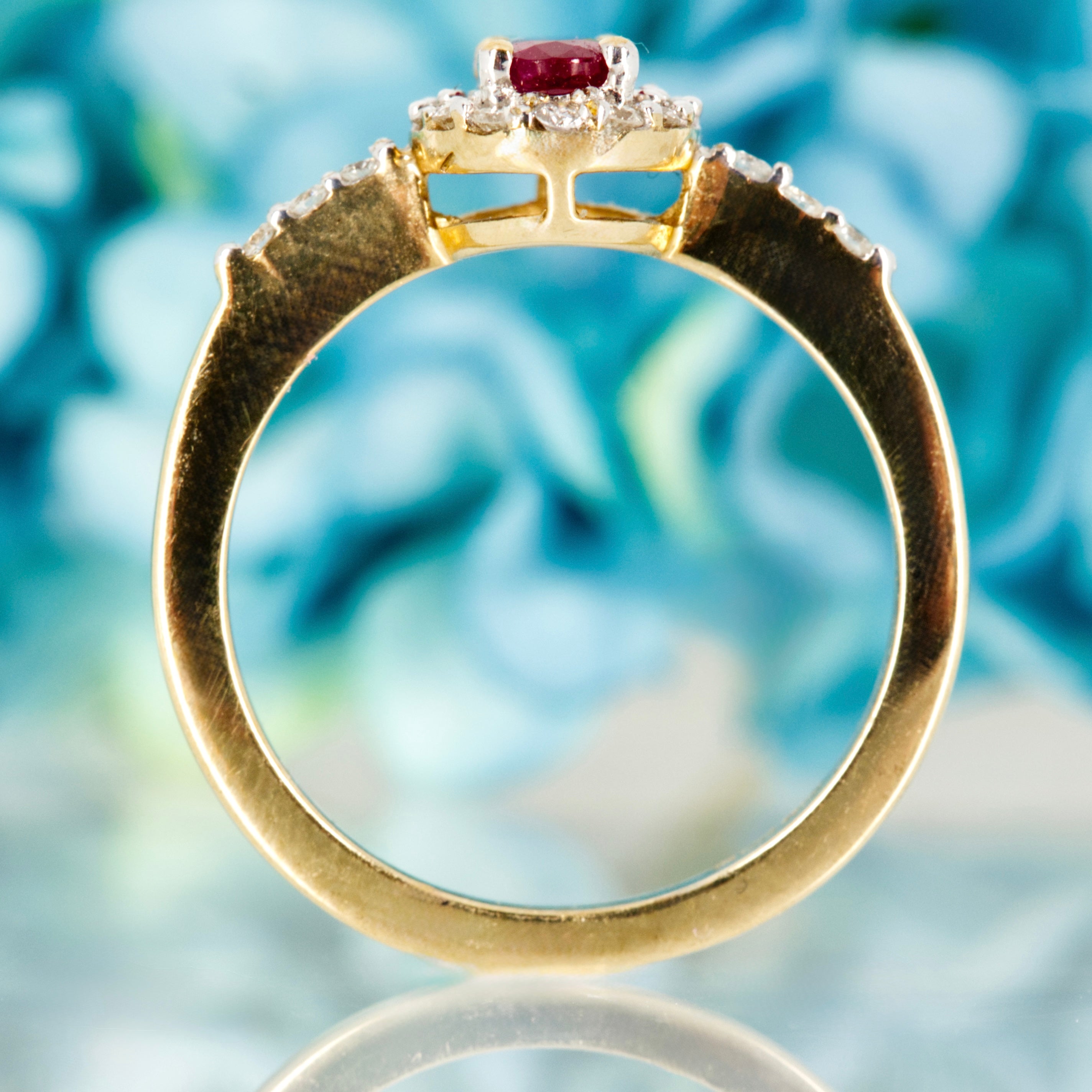 9ct Yellow Gold Oval Cut Ruby & Round Brilliant Cut Diamond Halo Cluster Ring
