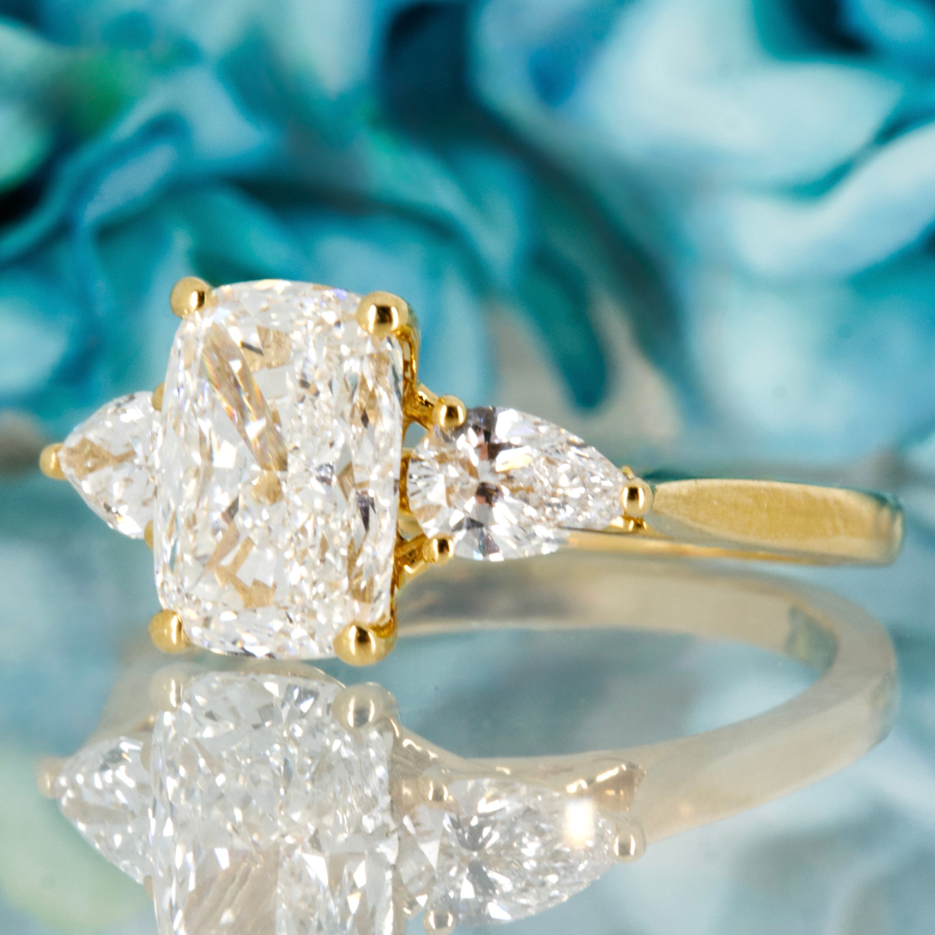 18ct Yellow Gold 2.59ct Cushion & Pear Cut Lab Grown Diamond Trilogy Ring