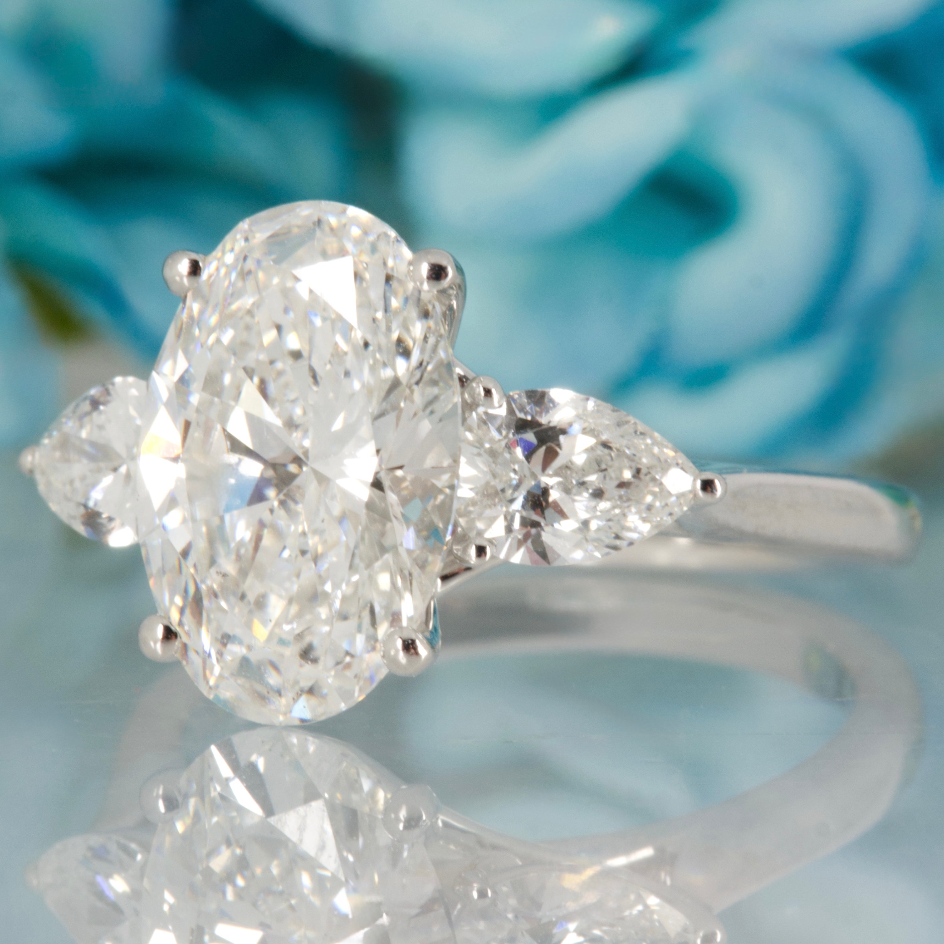 Platinum 3.69ct Oval & Pear Cut Lab Grown Diamond Trilogy Ring