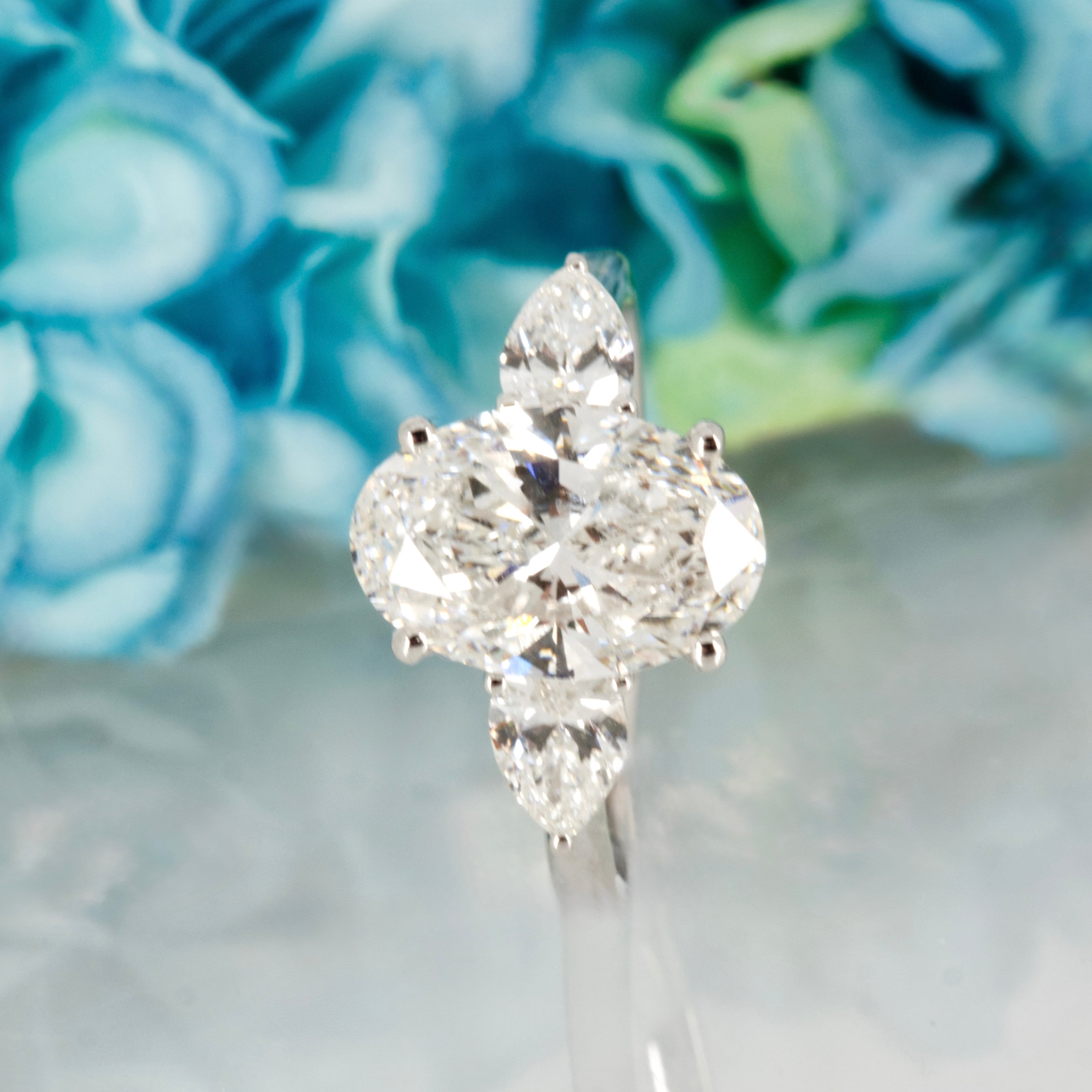 Platinum 3.69ct Oval & Pear Cut Lab Grown Diamond Trilogy Ring