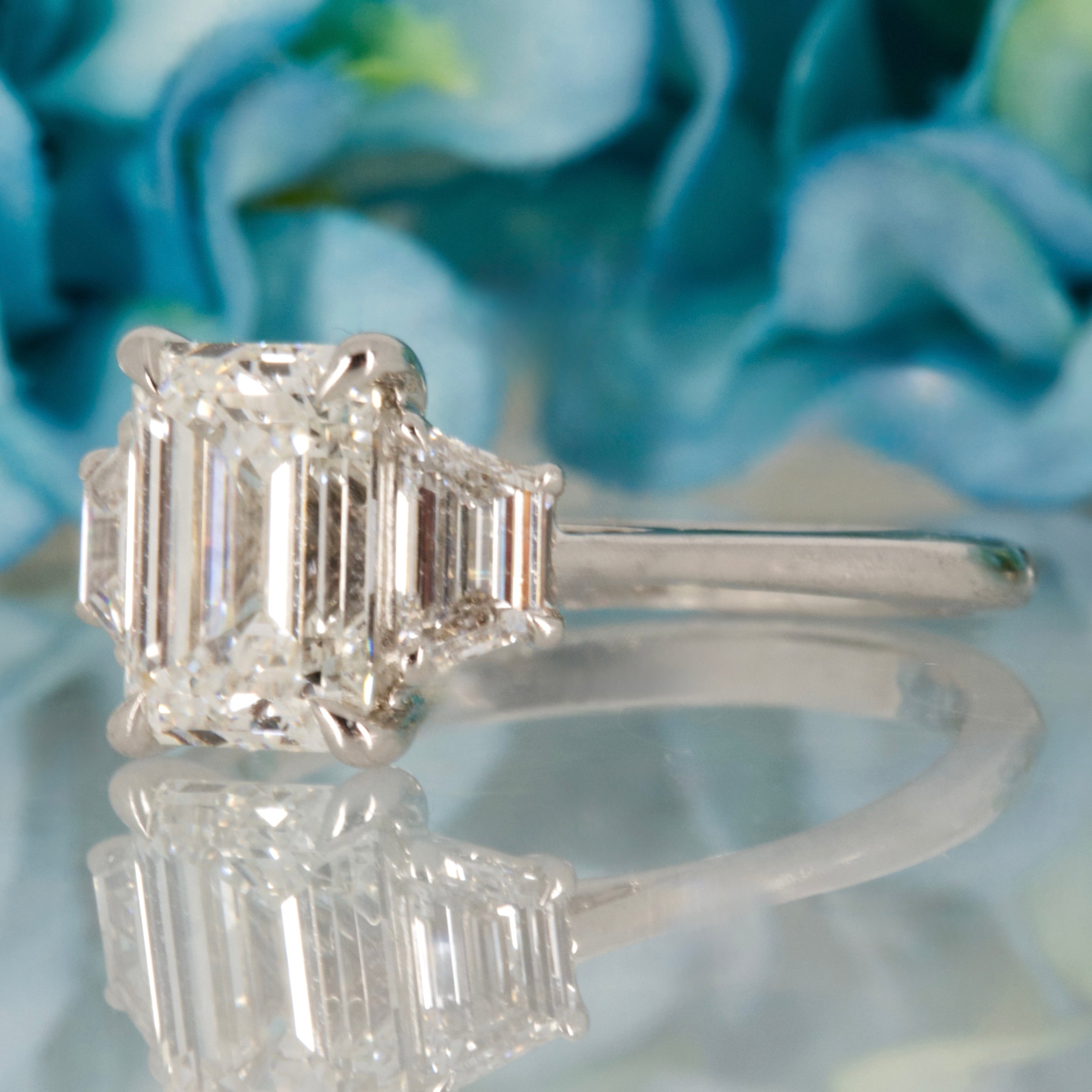 Platinum 2.63ct Emerald & Trapezoid Cut Lab Grown Diamond Trilogy Ring