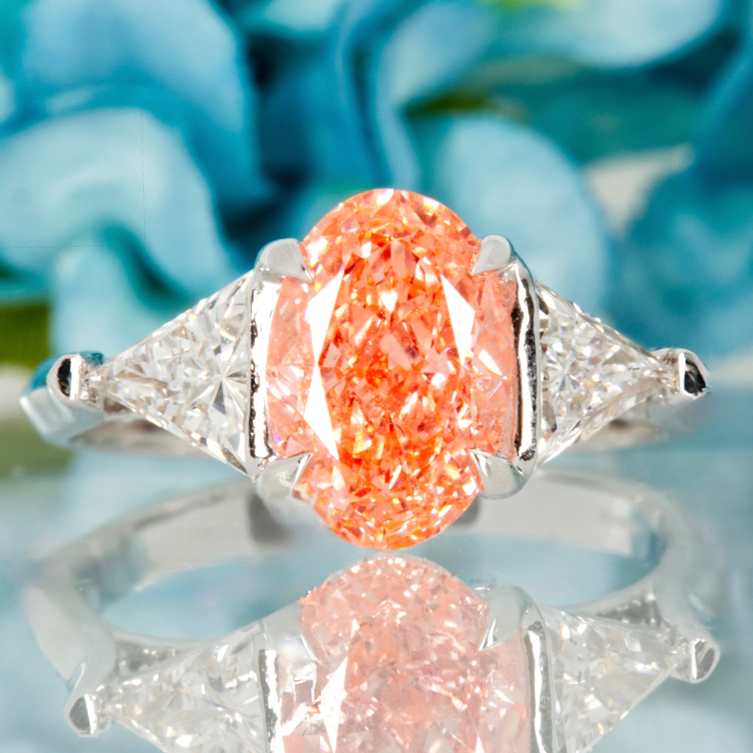 18ct White Gold Oval Cut Lab Grown Pink Diamond & Trilliant Cut Lab Grown Diamond Trilogy Ring