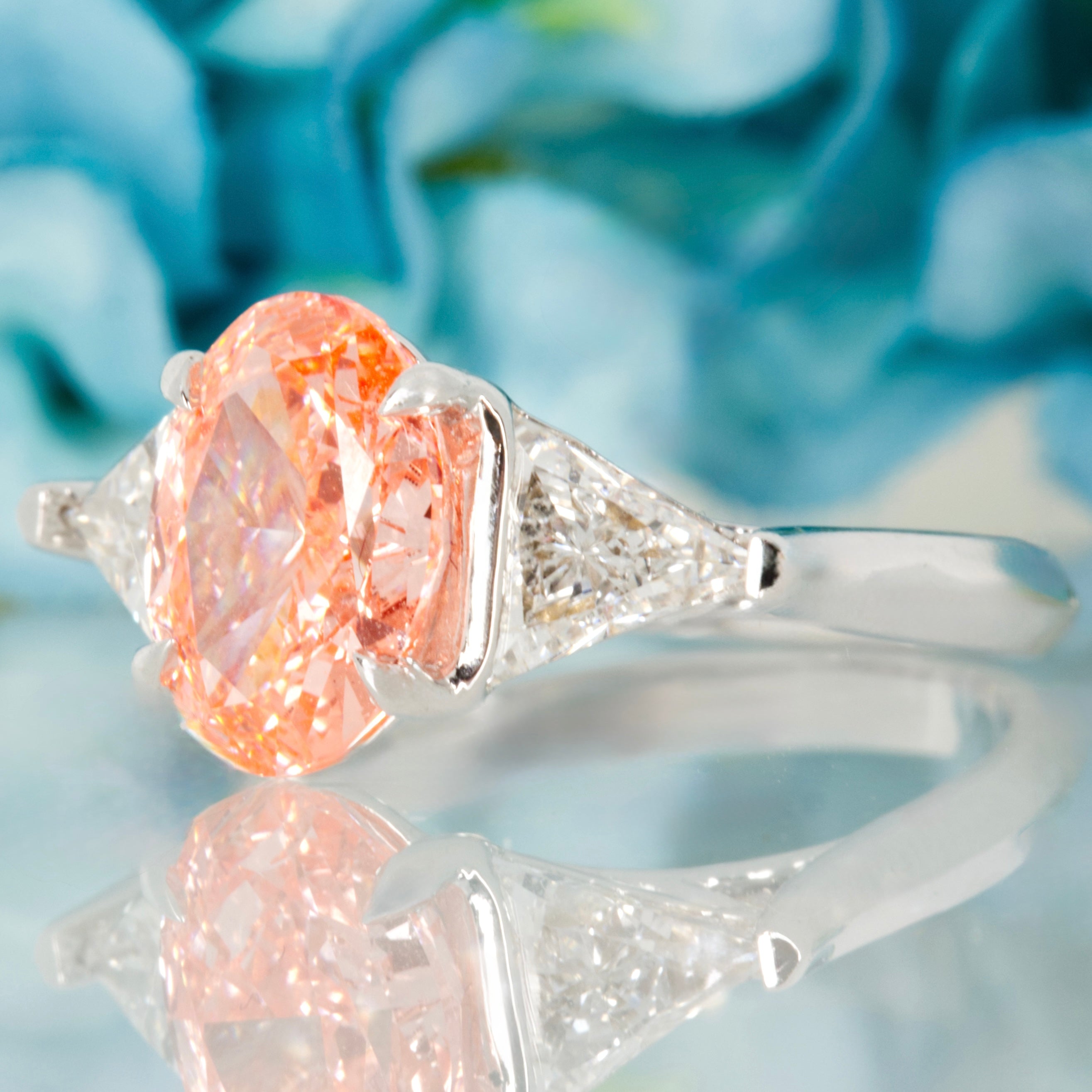 18ct White Gold Oval Cut Lab Grown Pink Diamond & Trilliant Cut Lab Grown Diamond Trilogy Ring