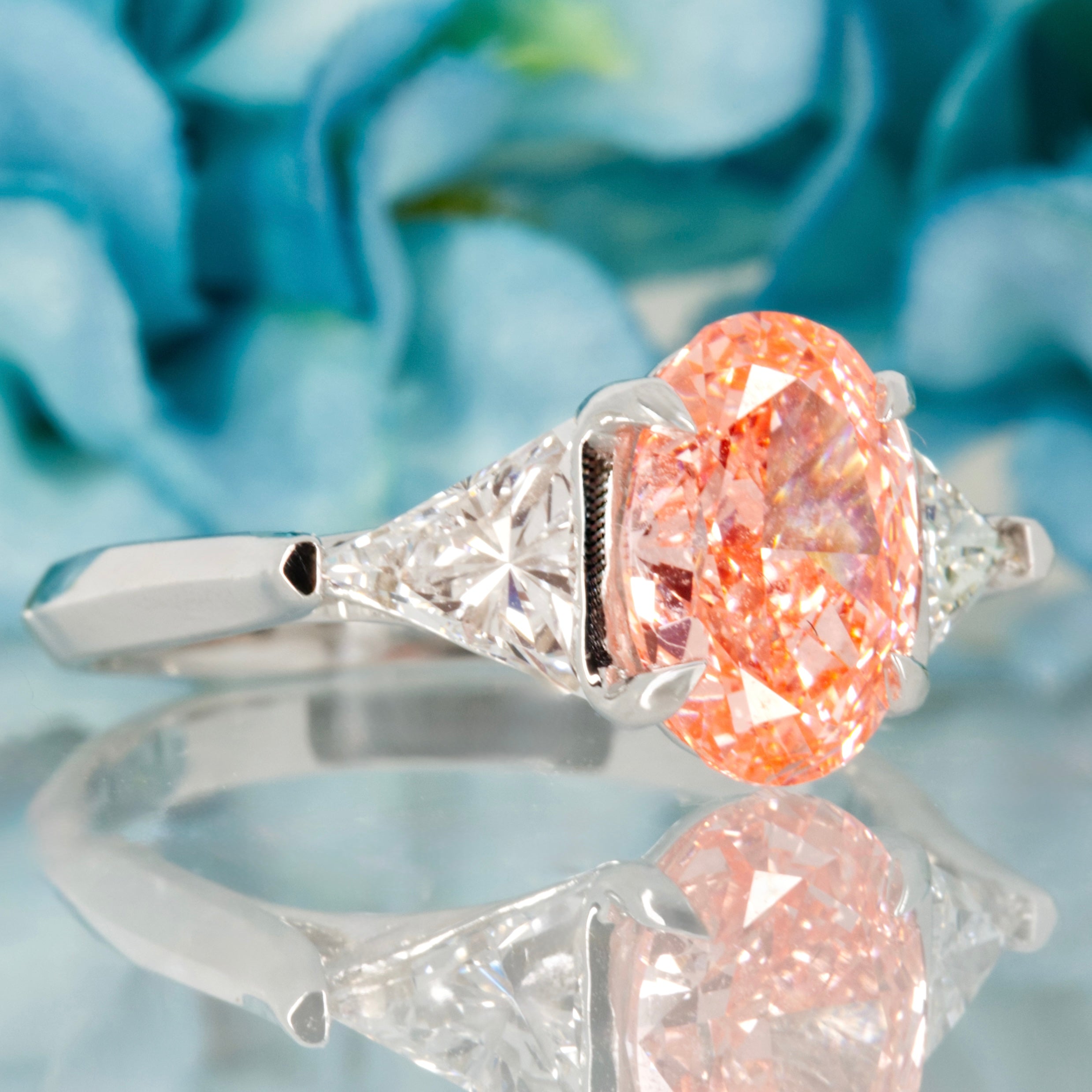 18ct White Gold Oval Cut Lab Grown Pink Diamond & Trilliant Cut Lab Grown Diamond Trilogy Ring