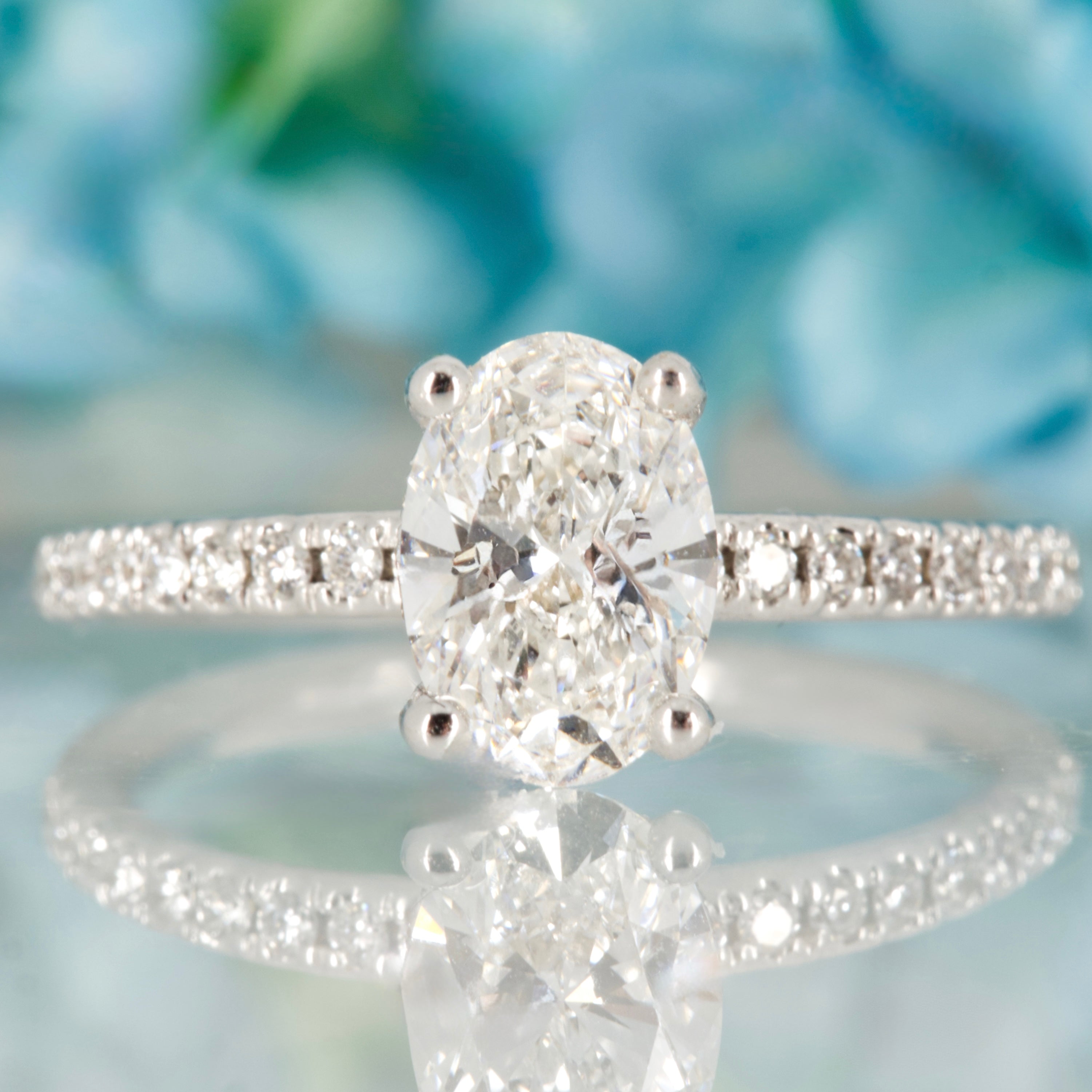 18ct White Gold 1.10ct Oval Cut Lab Grown Diamond Solitaire Ring with Lab Grown Diamond Shoulders