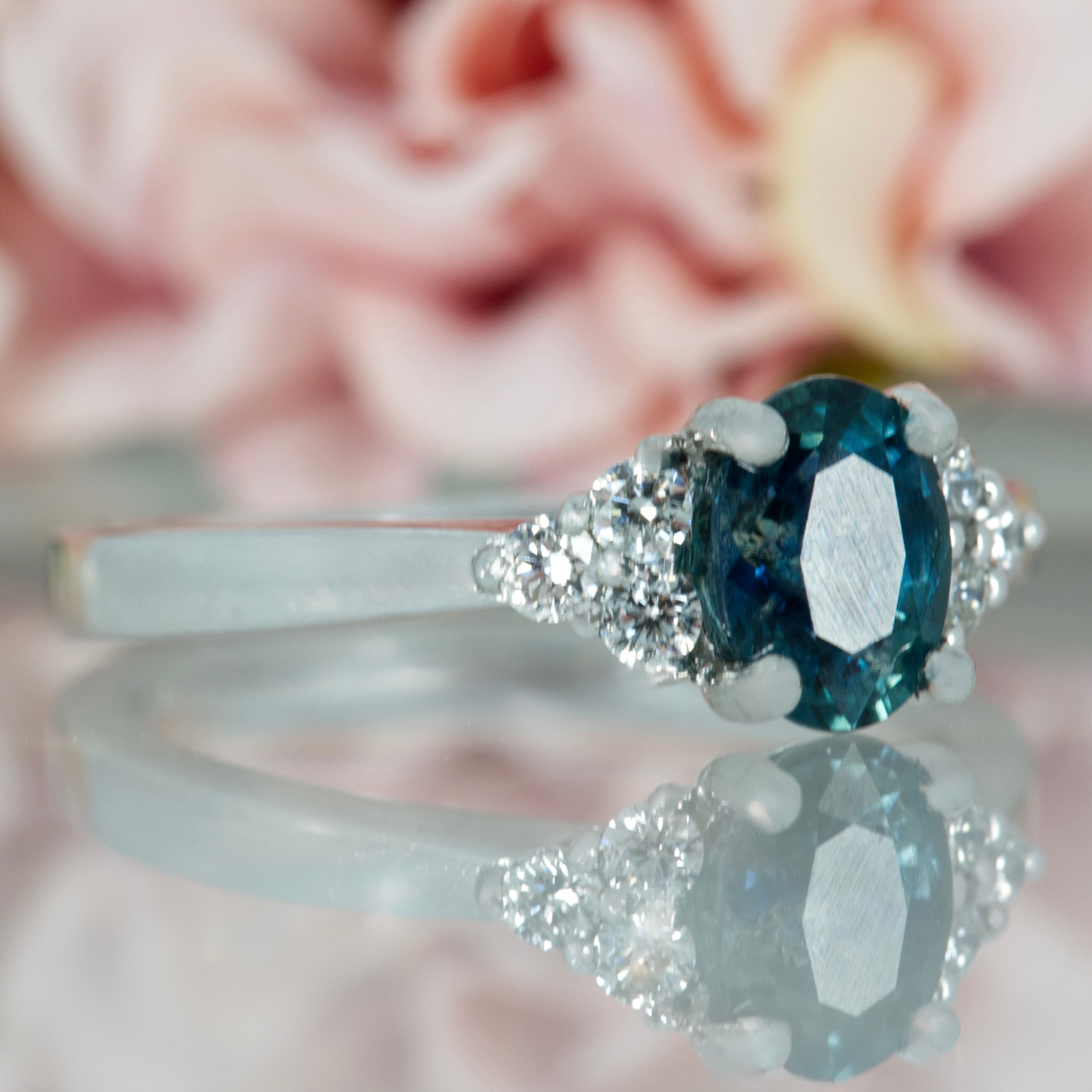 Platinum Oval Cut Montana Blue Sapphire & Round Brilliant Cut Diamond Trefoil Ring