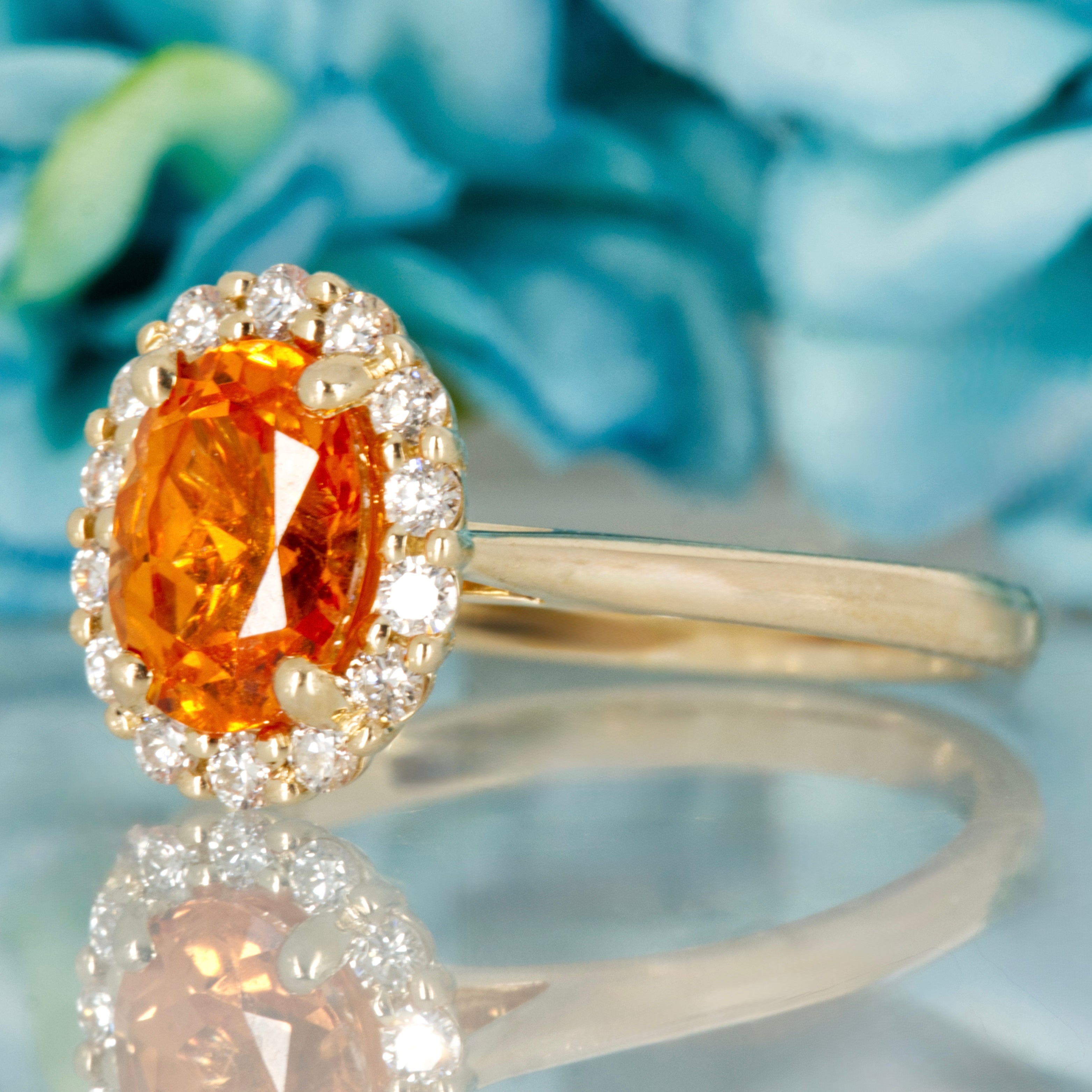 9ct Yellow Gold Oval Cut Spessartite Garnet & Round Brilliant Cut Diamond Halo Cluster Ring