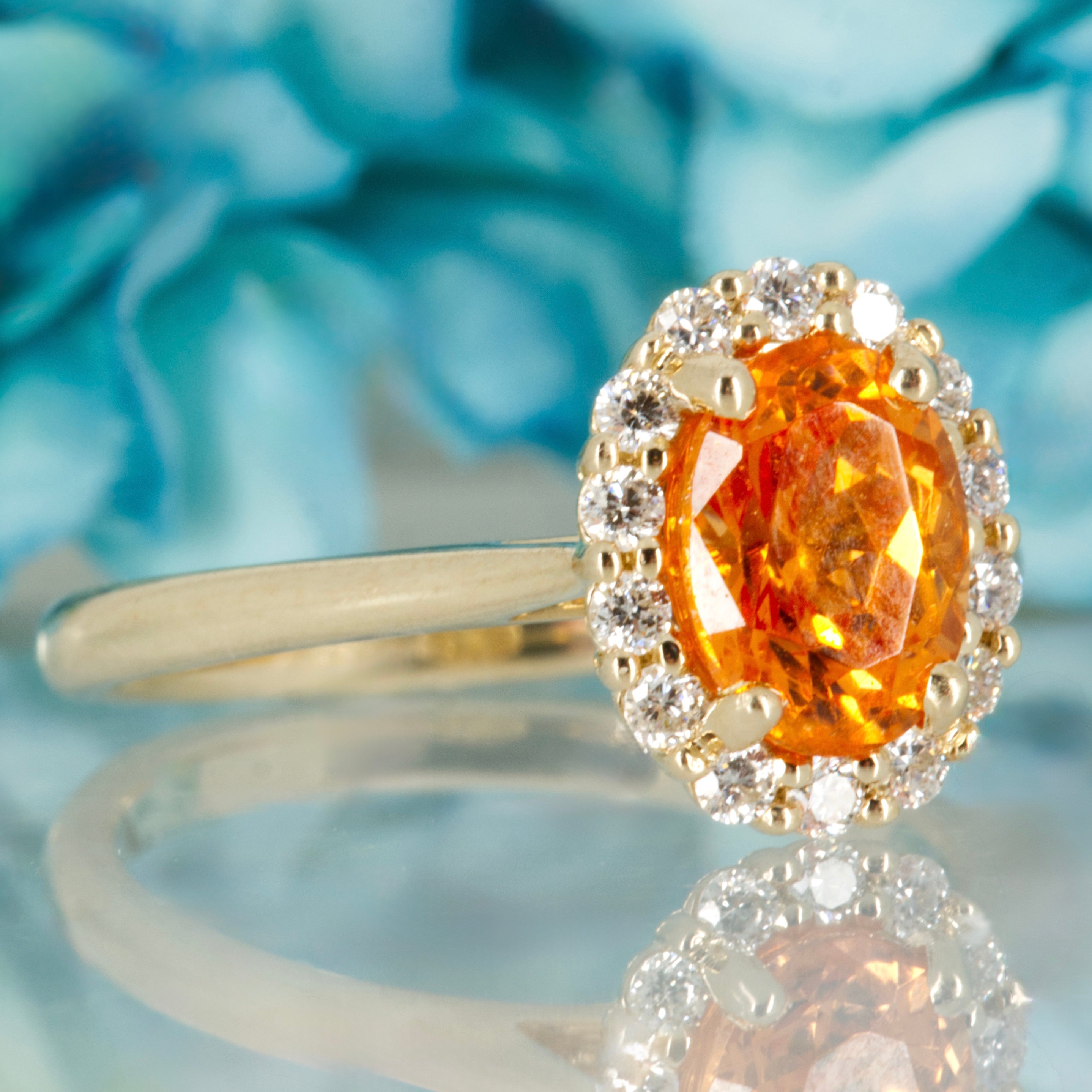 9ct Yellow Gold Oval Cut Spessartite Garnet & Round Brilliant Cut Diamond Halo Cluster Ring