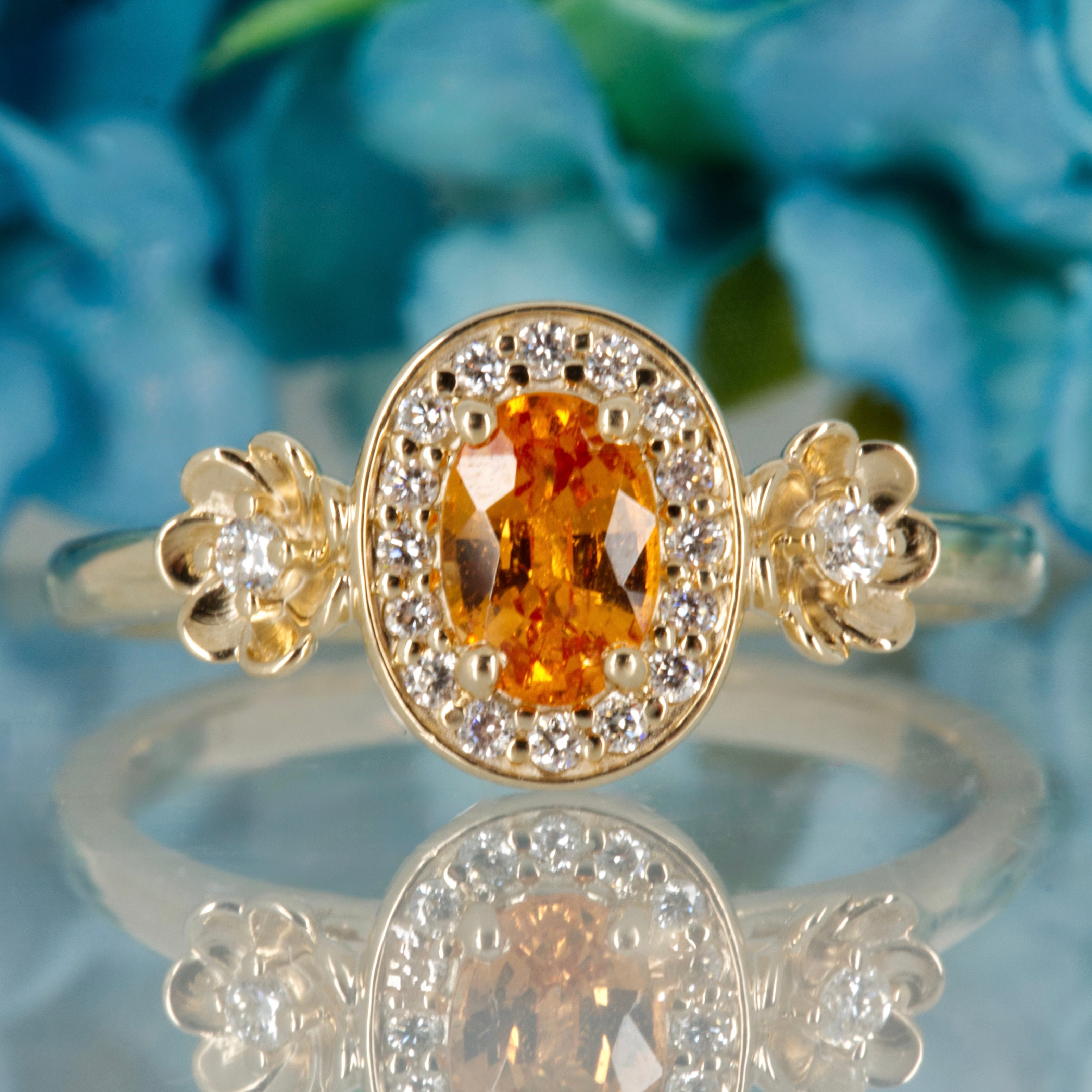 9ct Yellow Gold Oval Cut Spessartite Garnet & Round Brilliant Cut Diamond Halo Cluster Ring