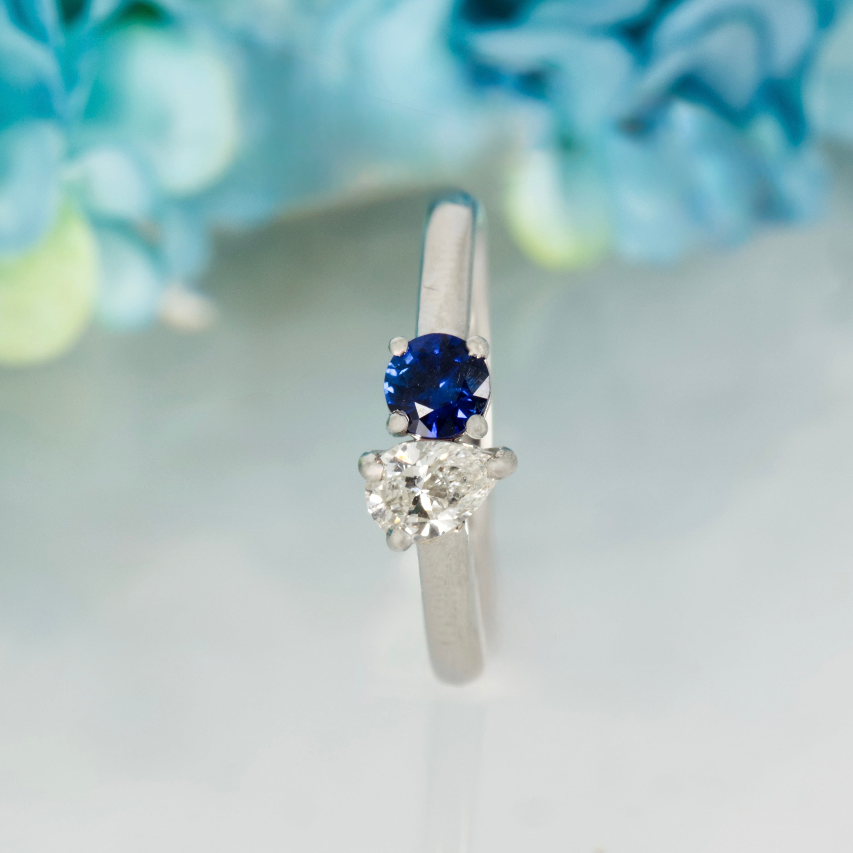 Platinum Round Cut Sapphire & Pear Cut Diamond Toi et Moi Ring